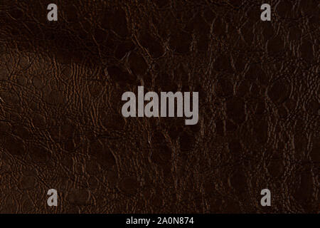 Dark brown leather, abstract background. Can be used as background in art or design projects. Stock Photo