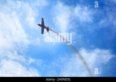 Novosibirsk, Russia, July 31, 2016, Mochishche airfield, local air show, airplane yak 52 on blue sky with clouds background, closeup Stock Photo