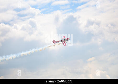 Novosibirsk, Russia, July 31, 2016, Mochishche airfield, local air show, airplane yak 52 on blue sky with clouds background, close up Stock Photo