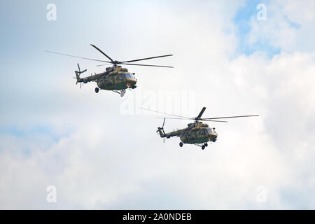 Novosibirsk, Russia, July 31, 2016, Mochishche airfield, local air show, two military helicopters Mi-8 in the sky close up Stock Photo