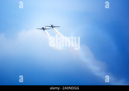 Novosibirsk, Russia, July 31, 2016, Mochishche airfield, local air show, two Yak-52 flying together, aerobatic team 'Open Sky', Barnaul Stock Photo