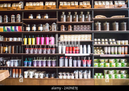 JULY 18, 2019-Ho Chi Minh City Vietnam : Mugs and tumblers decorated with Vietnam crafts displayed on a shelf at the Starbucks in Ho Chi Minh Vietnam. Stock Photo