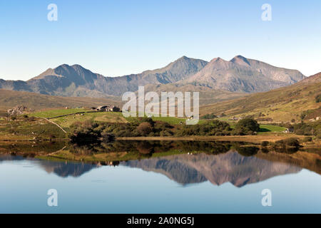 Llynnau Mymbyr are two joined lakes located in Dyffryn Mymbyr valley in Snowdonia and here seen with Mount Snowdon in the background. Stock Photo