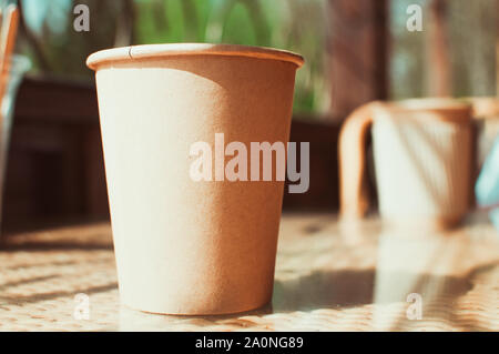 https://l450v.alamy.com/450v/2a0ng89/disposable-paper-coffee-cup-on-table-in-cafe-with-wooden-stirrerenvironmentally-friendly-lifestylezero-wastesave-the-planetearth-dayno-plasticre-2a0ng89.jpg