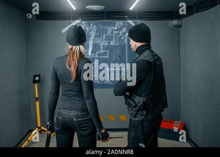 Two robbers working on a plan to rob the vault Stock Photo