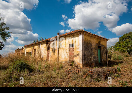A weathered, run-down building on a sunny day in rural Mozambique, Africa Stock Photo