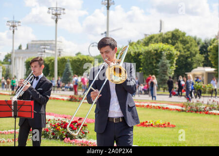 Moscow, Russia, New Life Brass band, wind musical instrument player, orchestra performs music, musician plays trombone, trumpeter man with trombone Stock Photo