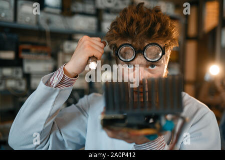 Strange engineer examines the cooling radiator Stock Photo