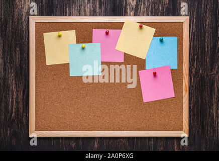 Blank colorful sticky notes or post-its on a cork board or bulletin board  Stock Photo - Alamy