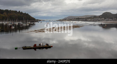 Small yachts are moored in the estuary of the River Conwy in North Wales. Stock Photo