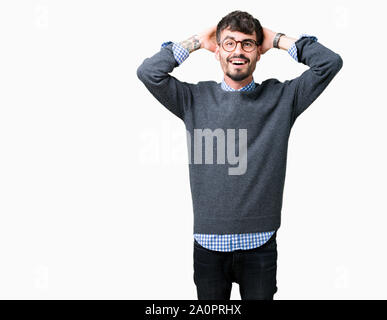 Young handsome smart man wearing glasses over isolated background Crazy and scared with hands on head, afraid and surprised of shock with open mouth Stock Photo
