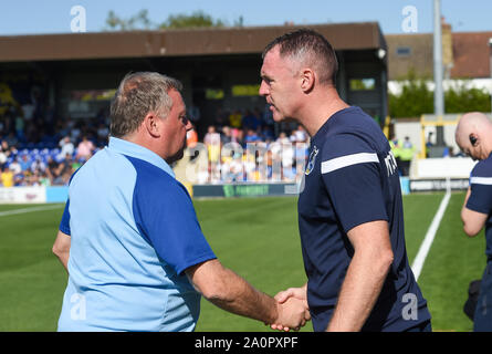London UK 21 September 2019 - AFC Wimbledon manager Wally Downes (left) with Bristol Rovers manager Graham Coughlan during the Sky Bet League One football match between AFC Wimbledon and Bristol Rovers at the Cherry Red Records Stadium - Editorial use only. No merchandising. For Football images FA and Premier League restrictions apply inc. no internet/mobile usage without FAPL license - for details contact Football Dataco . Credit : Simon Dack TPI / Alamy Live News Stock Photo