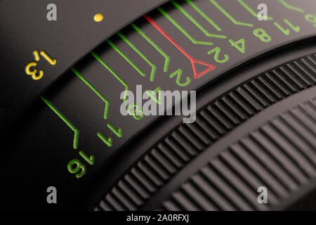 Close up of aperture ring of camera lens. Vintage camera lens close-up. Stock Photo