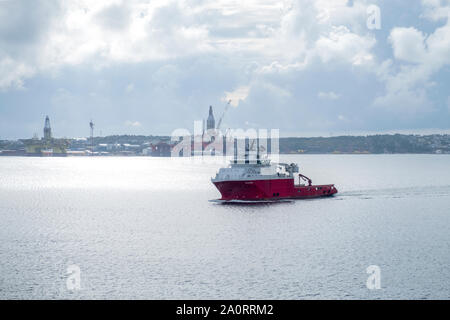 Oil drilling platforms being built and maintained and ice breaking service ship in Bergen harbour, Norway Stock Photo