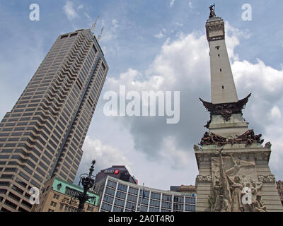 Low angle view of Soldiers & Sailors Monument and Salesforce Tower, Indianapolis, Indiana, USA, July 26, 2019, © Katharine Andriotis Stock Photo