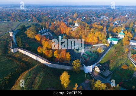 Holy Dormition Pskovo-Pechersky Monastery in Pechory in the golden autumn (shooting from a quadrocopter). Russia Stock Photo