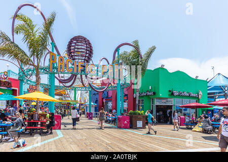 Santa Monica, California USA. May 30, 2019. Tourists colorful crowd walking on Santa Monica pier, Los Angeles, sunny spring day Stock Photo