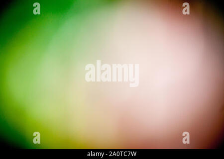 An abstract defocused round shaped green and red lights on black backdrop Stock Photo