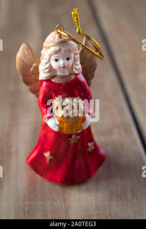 Angel christmas tree decoration, on wooden surface Stock Photo