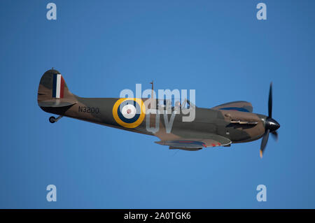 Duxford, Cambridgeshire, UK. 21st September 2019. 1940’s themed weekend of flying at IWM Duxford with historic WW2 aircraft and a massed flight of 15 Spitfires, commemorating the 50th anniversary of the film ‘Battle of Britain’. Scenes from the film, including the famous exploding hangar, were shot on location at Duxford. Image: Spitfire Mk Ia of the Imperial War Museums collection. Credit: Malcolm Park/Alamy Live News. Stock Photo