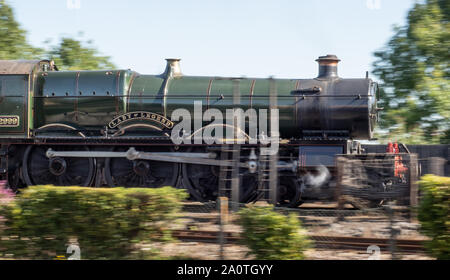 Steam train passing at speed Stock Photo