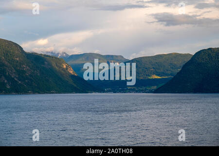 Queen Mary 2 liner cruising in a Norwegian fjord towards Flaam Stock Photo