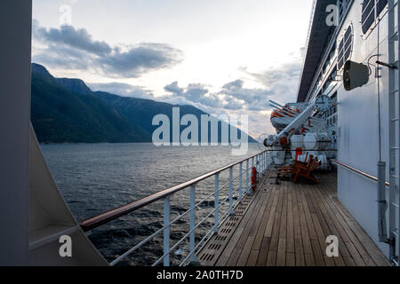 Queen Mary 2 liner cruising in a Norwegian fjord towards Flaam Stock Photo