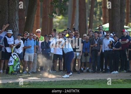 Virginia Water, UK. 21st Sep, 2019. Erik Van Rooyen plays a shot from a footpath on the 13th hole competing in round three of the BMW PGA Championship, European Tour Golf Tournament at Wentworth Golf Club, Virginia Water, Surrey, England. Credit: ESPA/Alamy Live News Stock Photo