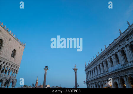 Doge's palace, Venice, Italy, with St Theodore and winged-lion columns in the piazzetta Stock Photo