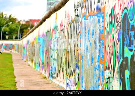 BERLIN, GERMANY - SEPTEMBER 15: Berlin Wall graffiti seen on Saturday, September 21, 2019 Berlin, East Side Gallery, Berlin Wall famous memorial. Stock Photo