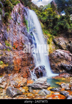 Mighty blurred Cedar waterfall in Never Never part of Dorrigo National park - part of ancient Gondwana rainforests, Australia, NSW. Stock Photo