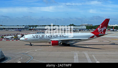 Virgin Atlantic Strawberry Fields Airbus A330-200 taxi-ing from apron at Manchester Ringway Airport, Lancashire, England, UK Stock Photo