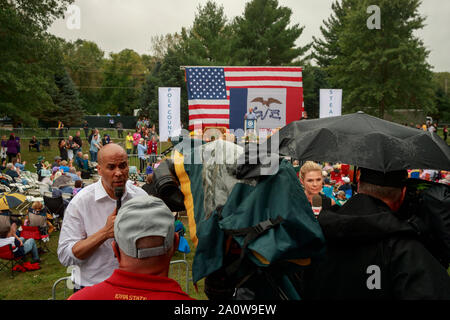 Cory Booker, left, speaks on MSNBC saying he needs to raise more money to stay in the presidential race during the Polk County Steak Fry, Saturday, September 21, 2019 at Water Works Park in Des Moines, Iowa. The steak fry was the largest in Iowa's history and was attended by 12,000 Democrats from around Iowa. The event drew in 17 candidates for the democratic nomination for president of the United States. The Iowa Caucasus are Monday, February 3, 2020 and although not a primary will narrow down the field of candidates for president before the first election primary in the state of New Hampshir Stock Photo