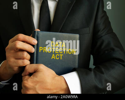 Lawyer is holding Data Protection Act book. Stock Photo