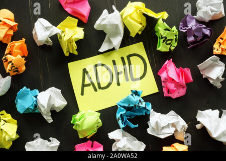 ADHD Attention deficit hyperactivity disorder sign and paper balls. Stock Photo