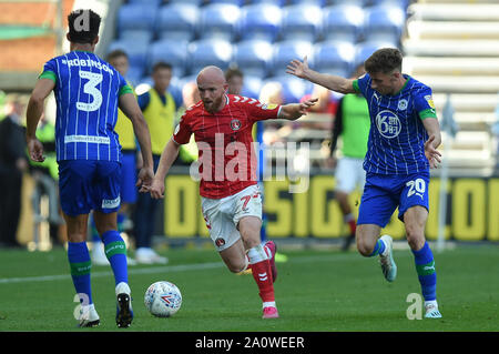 21st September 2019, DW Stadium, Wigan, England; Sky Bet Championship Football, Wigan Athletic vs Charlton Athletic ; Jonathan Williams (7) of Charlton Athletic challenged by Joe Williams (20) of Wigan Athletic   Credit: Richard Long/News Images  English Football League images are subject to DataCo Licence Stock Photo