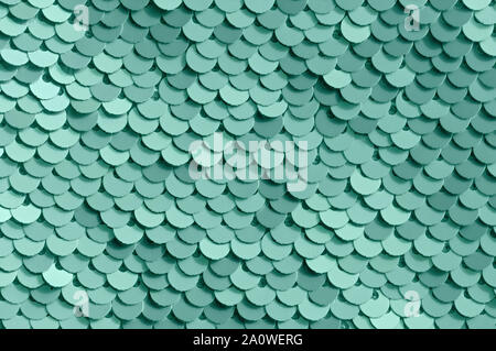 Abstract background of colored sequins. Color neo mint. Close up. Stock Photo