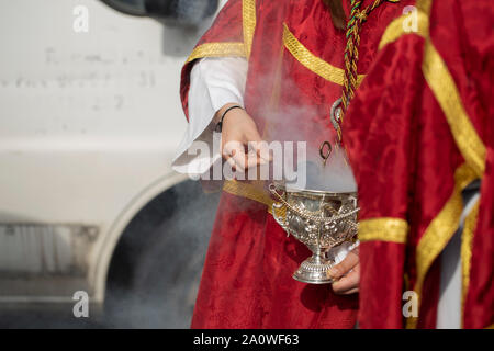 Child holding a censer in a procession, Holy Week Stock Photo