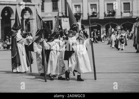 Hooded people in a procession, Holy Week Stock Photo