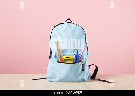 Stationery background on pink. School supplies, studying concept