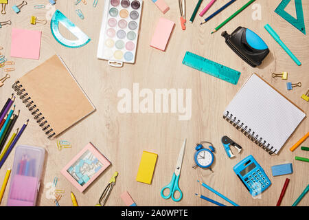top view of various school supplies on wooden desk Stock Photo
