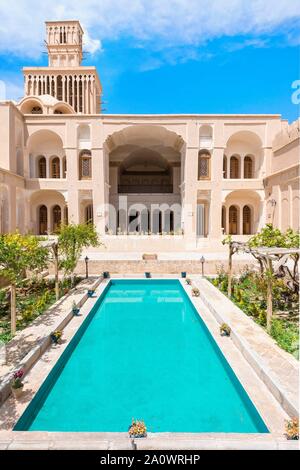 Aghazadeh Mansion and its windcatcher, courtyard with water basin , Abarkuh, Yazd Province, Iran Stock Photo