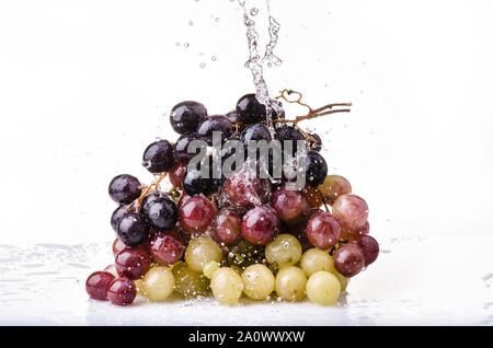 bunch of table grapes with splash of water Stock Photo