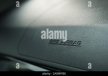 Close-up view of the safety SRS airbag sign on the car dashboard. Stock Photo
