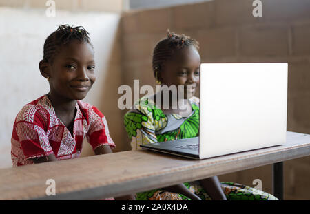 Smiling African Children working with Laptop Computer Stock Photo