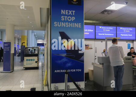 London, UK. 22nd Sept 2019. Permission Granted*. A large poster advertising of Thomas Cook airlines at Gatwick Airport as the tour operator faces  financial difficulties with 150,000 passengers stranded abroad. Thomas Cook needs to raise another £200million to avoid going into administration  Credit: amer ghazzal/Alamy Live News Stock Photo