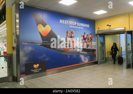 London, United Kingdom - 22 September 2019 . *Permission Granted*. A large poster advertising of Thomas Cook airlines at Gatwick Airport as the tour operator faces  financial difficulties with 150,000 passengers and holidaymakers stranded abroad. Thomas Cook needs to raise another £200million to avoid going into administration  Credit: amer ghazzal/Alamy Live News Stock Photo