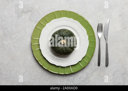 Thanksgiving table setting with tableware at gray concrete background. Concept of Halloween dinner set Stock Photo