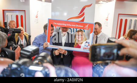 Brighton UK 22 September 2019 - Jeremy Corbyn the leader of the Labour Party poses for photographs as he tours the stands at the Labour Party Conference being held in the Brighton Centre this year. Credit : Simon Dack / Alamy Live News Stock Photo