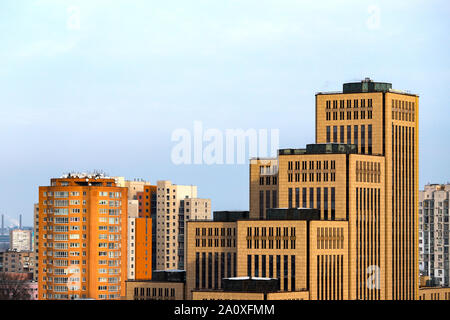 View of the big city, tall majestic yellow buildings, towers and skyscrapers in the downtown of Dnipro city, Dnepropetrovsk Ukraine.